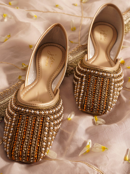 traditional juttis with intricate striped beadwork covering the entire upper
 White