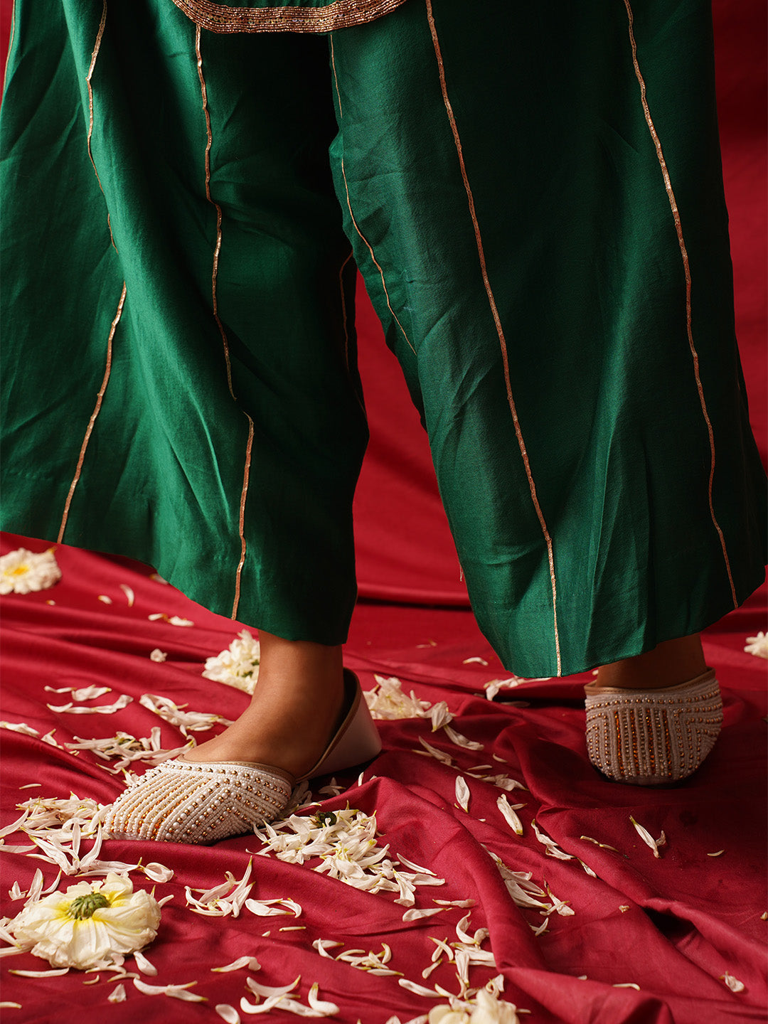 traditional juttis with intricate striped beadwork covering the entire upper
 Green