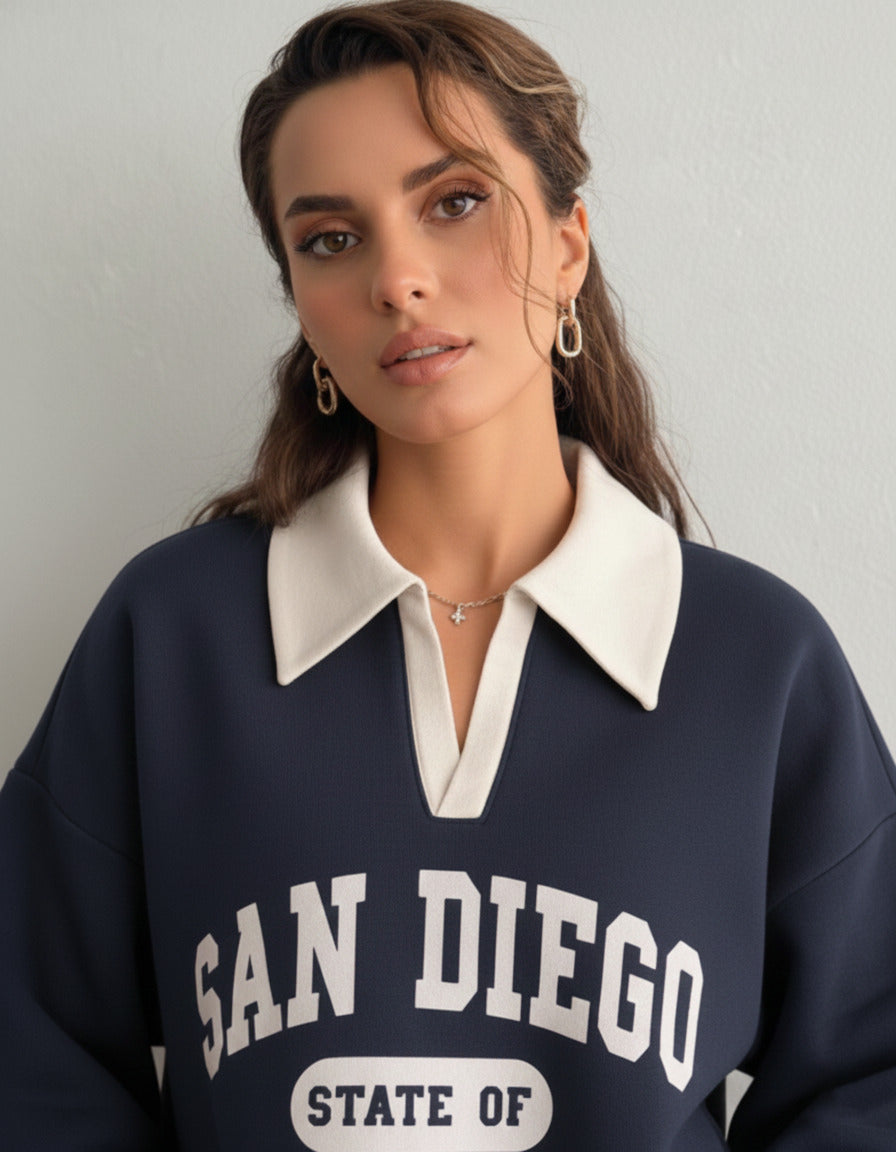 Collared sweatshirt for women in blue with contrast white polo collar and San Diego varsity