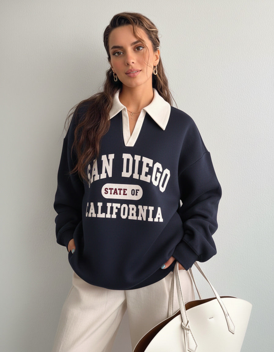 Collared sweatshirt for women in blue with contrast white polo collar and San Diego varsity