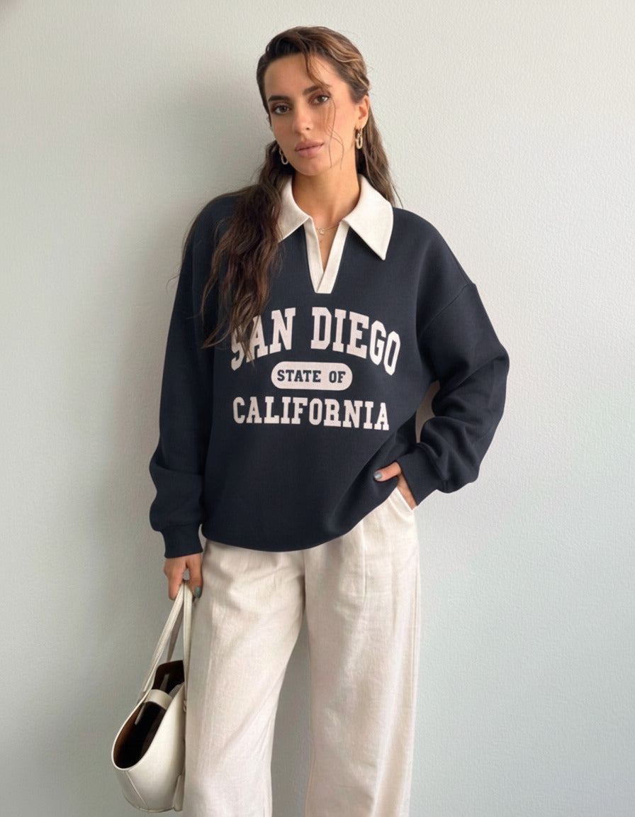 Collared sweatshirt for women in blue with contrast white polo collar and San Diego varsity