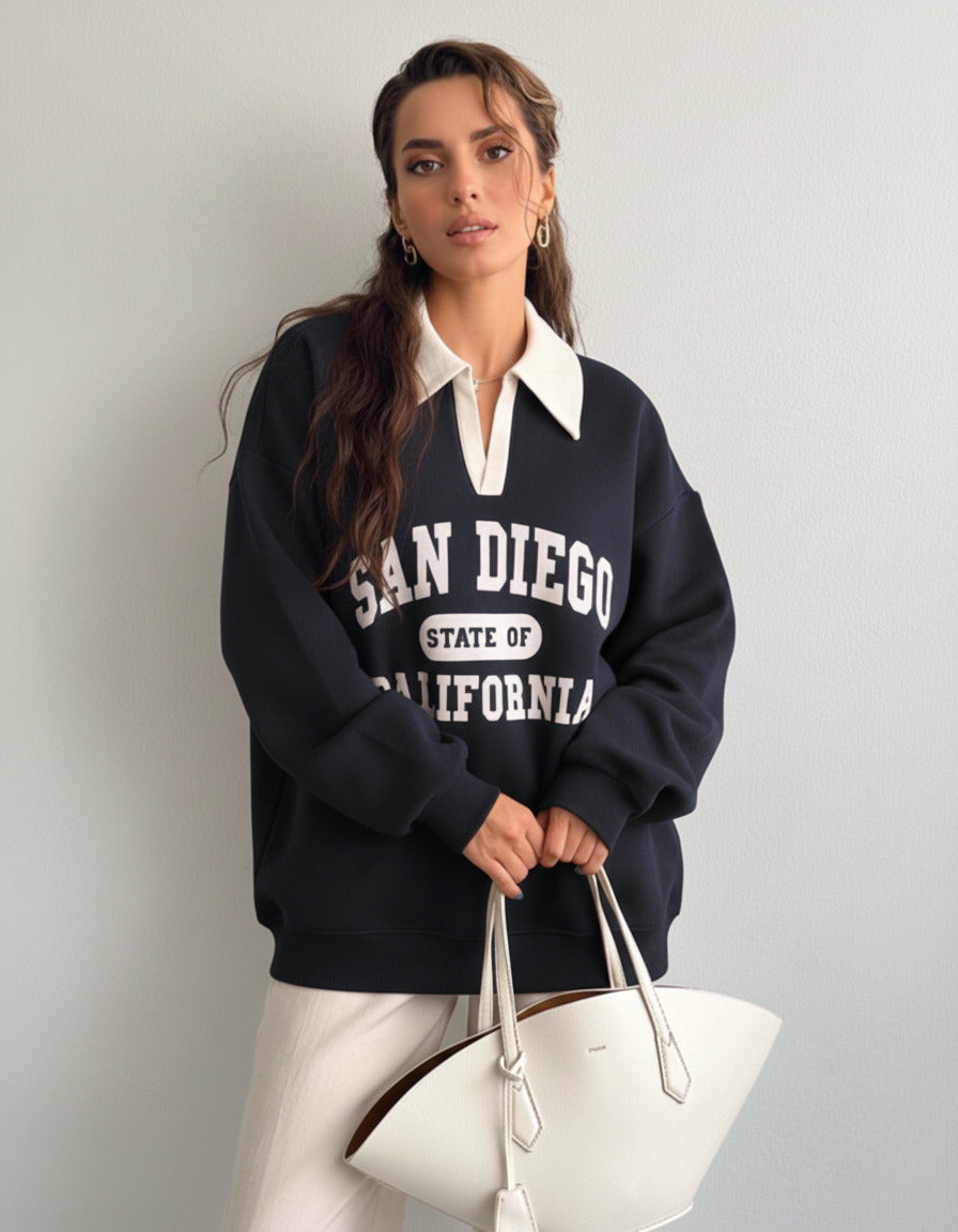Collared sweatshirt for women in blue with contrast white polo collar and San Diego varsity