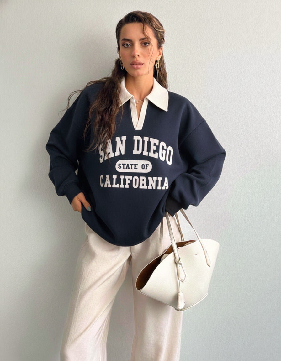 Collared sweatshirt for women in blue with contrast white polo collar and San Diego varsity