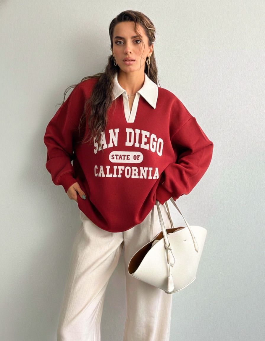 Collared sweatshirt for women in red with contrast white polo collar and San Diego varsity