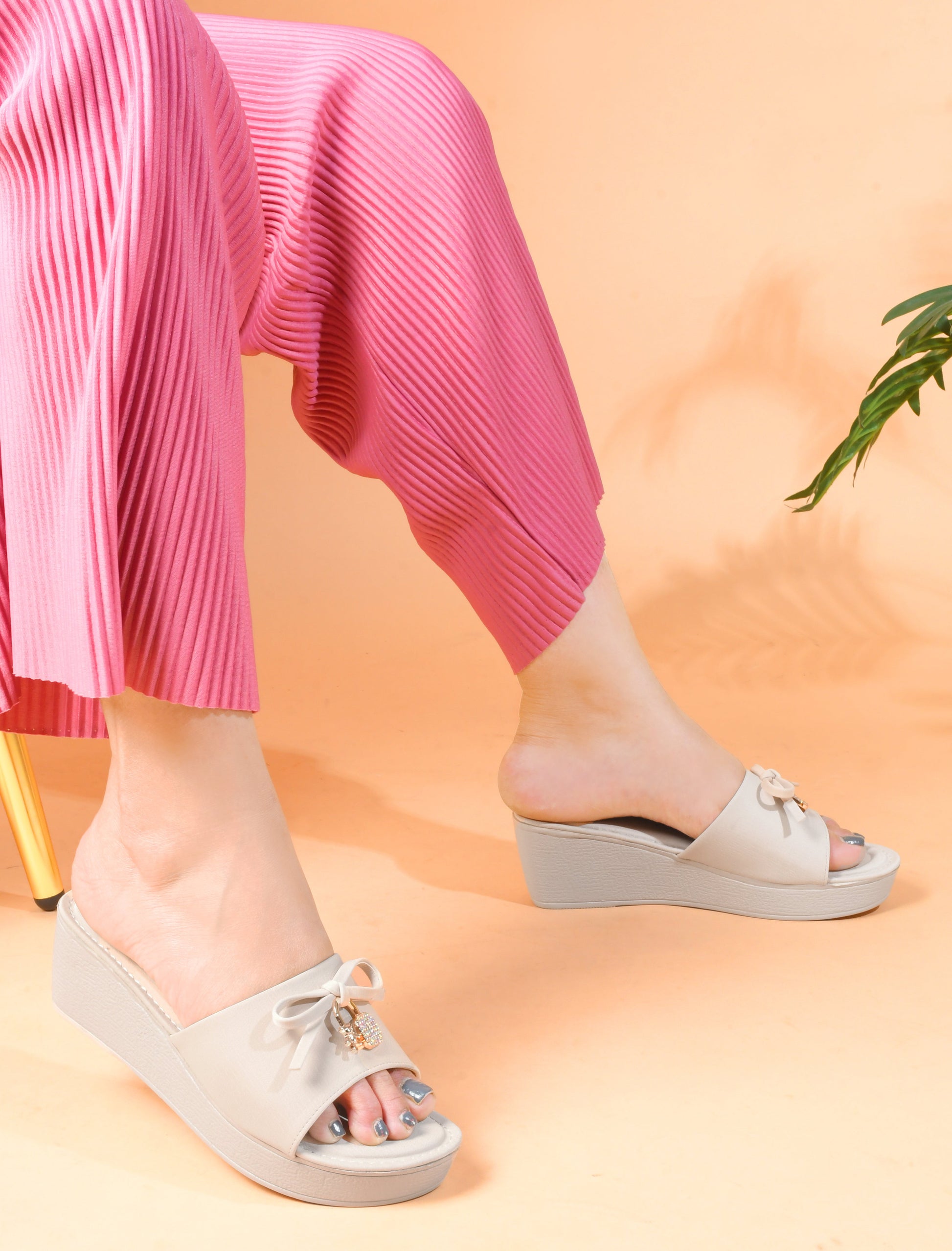 Jm Looks wedge slides with a decorative bow on the strap
 Cream
