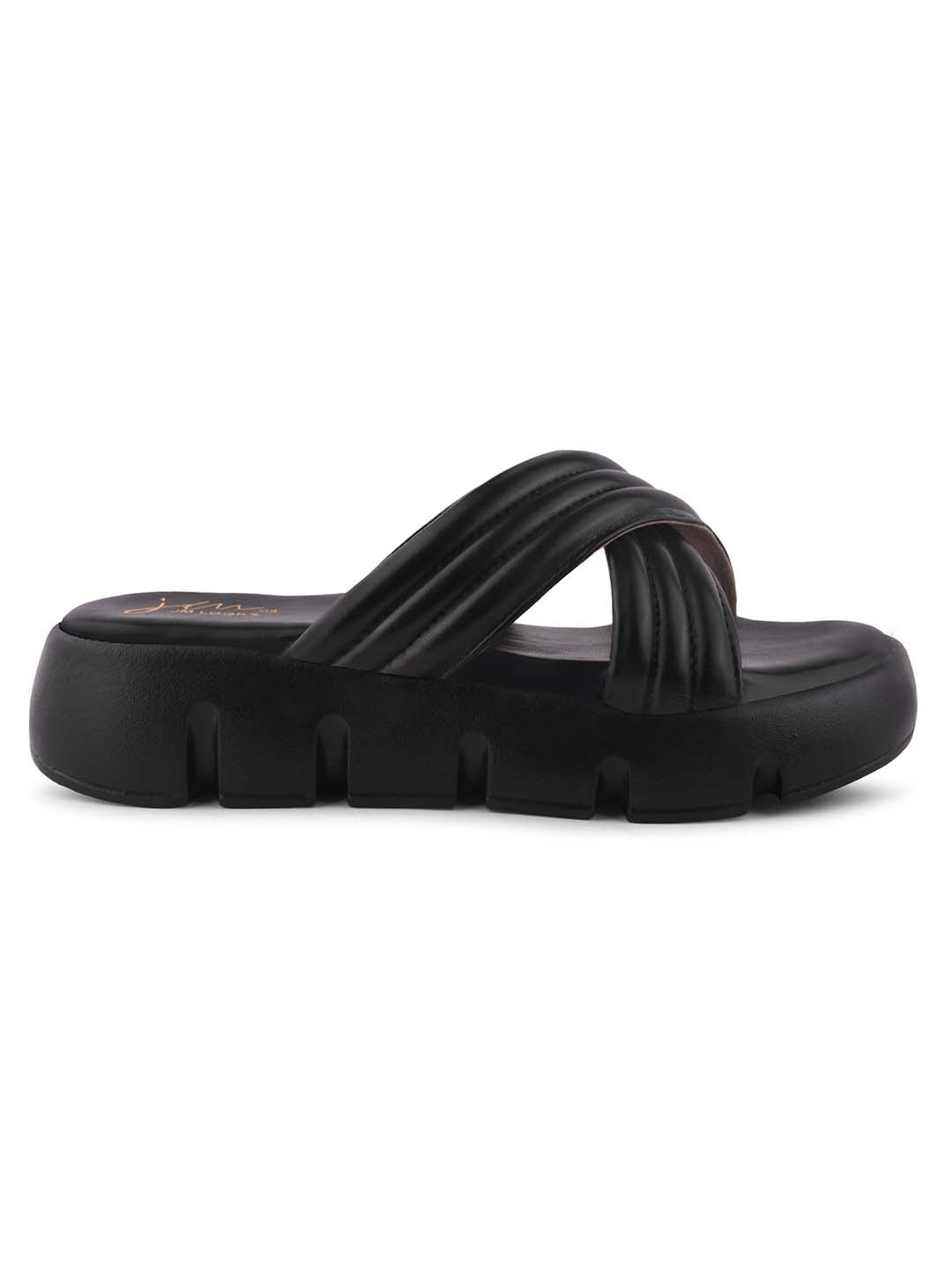 women's platform slides with wide, padded crisscross straps and a chunky lug sole
 Black