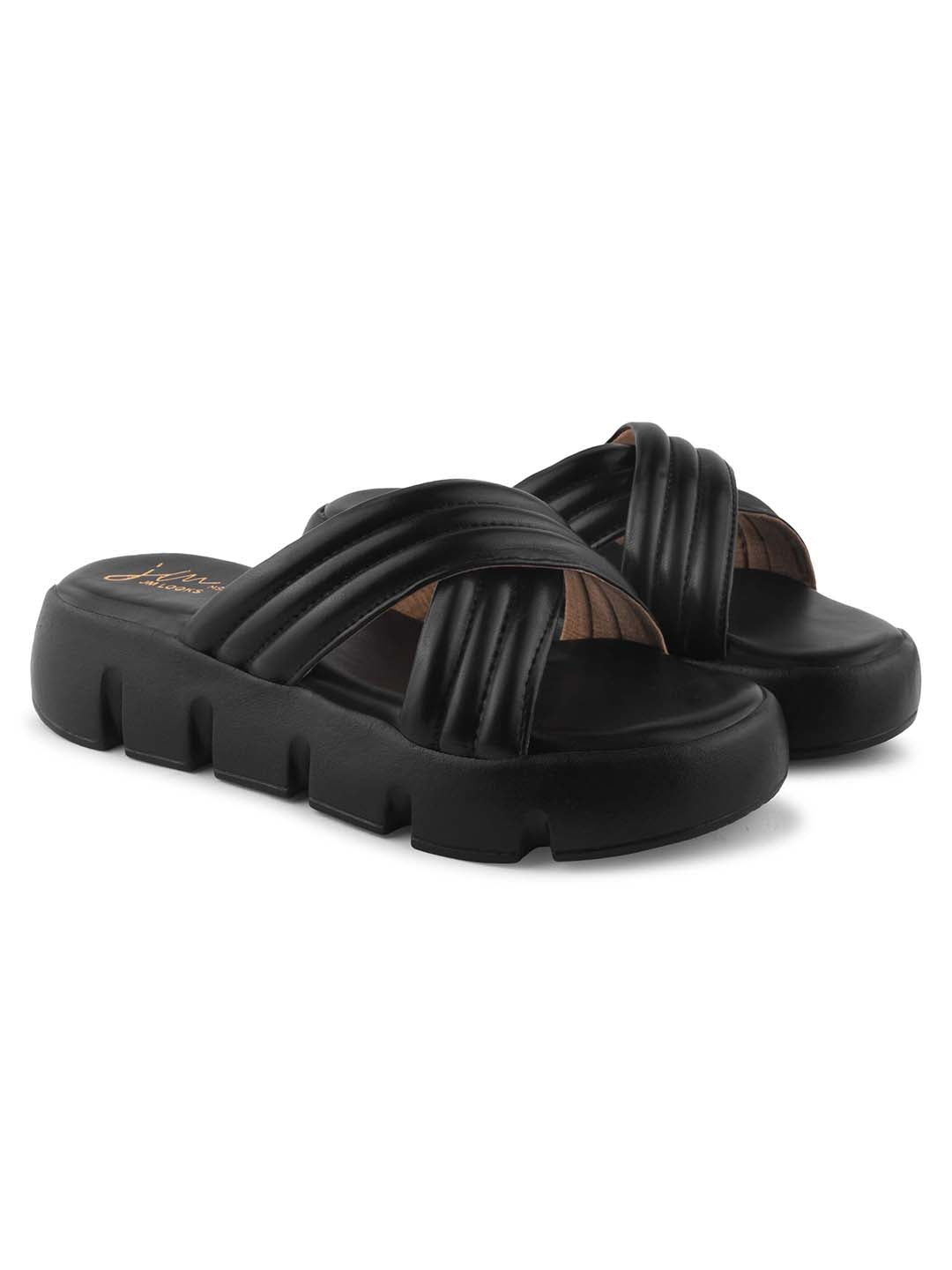 women's platform slides with wide, padded crisscross straps and a chunky lug sole
 Black