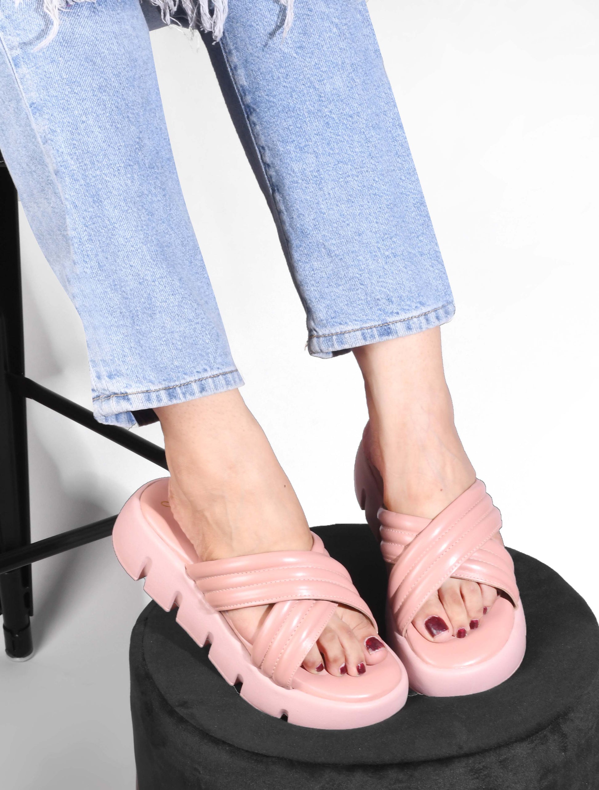 women's platform slides with wide, padded crisscross straps and a chunky lug sole
 Peach