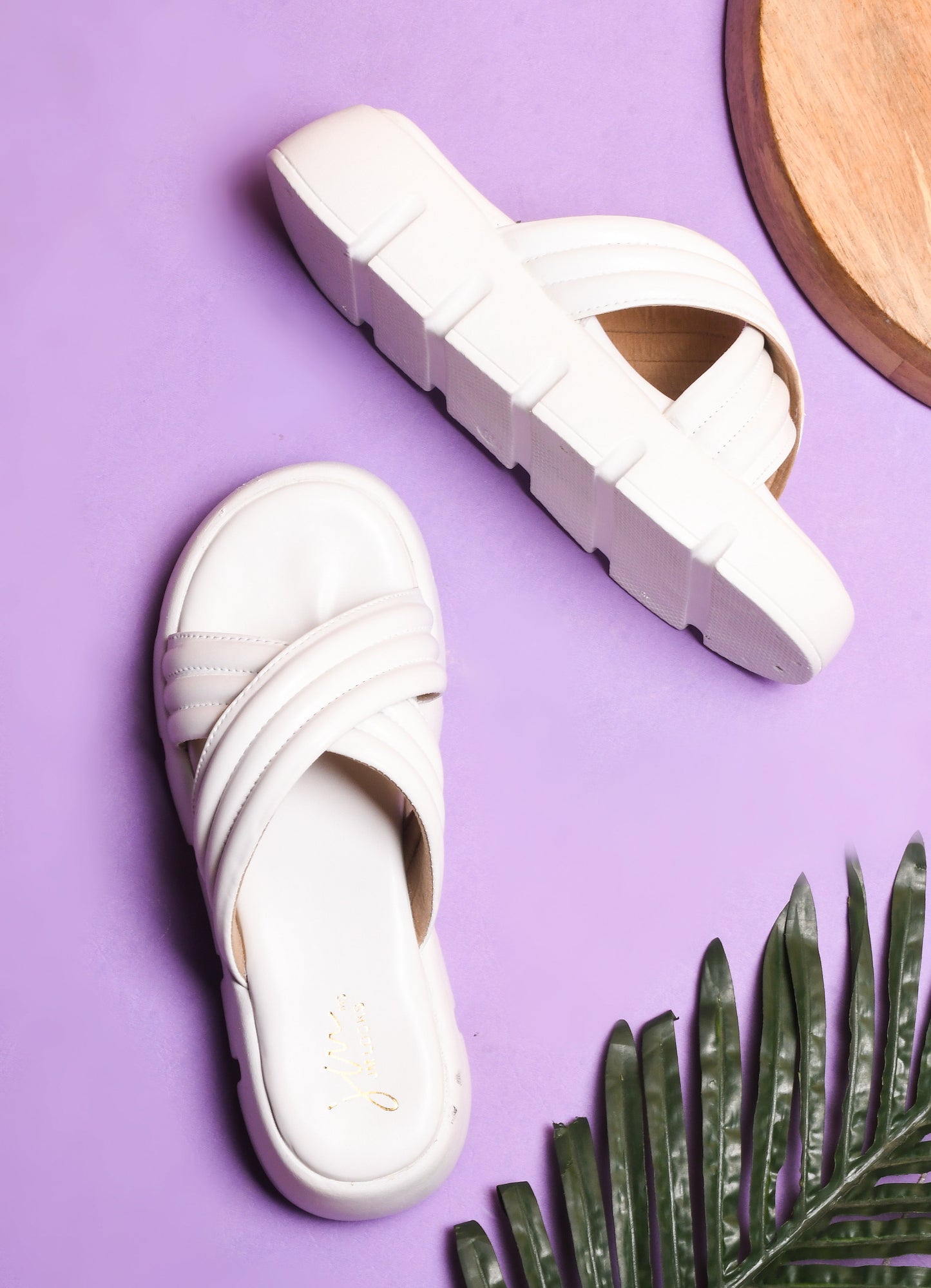 women's platform slides with wide, padded crisscross straps and a chunky lug sole
 White