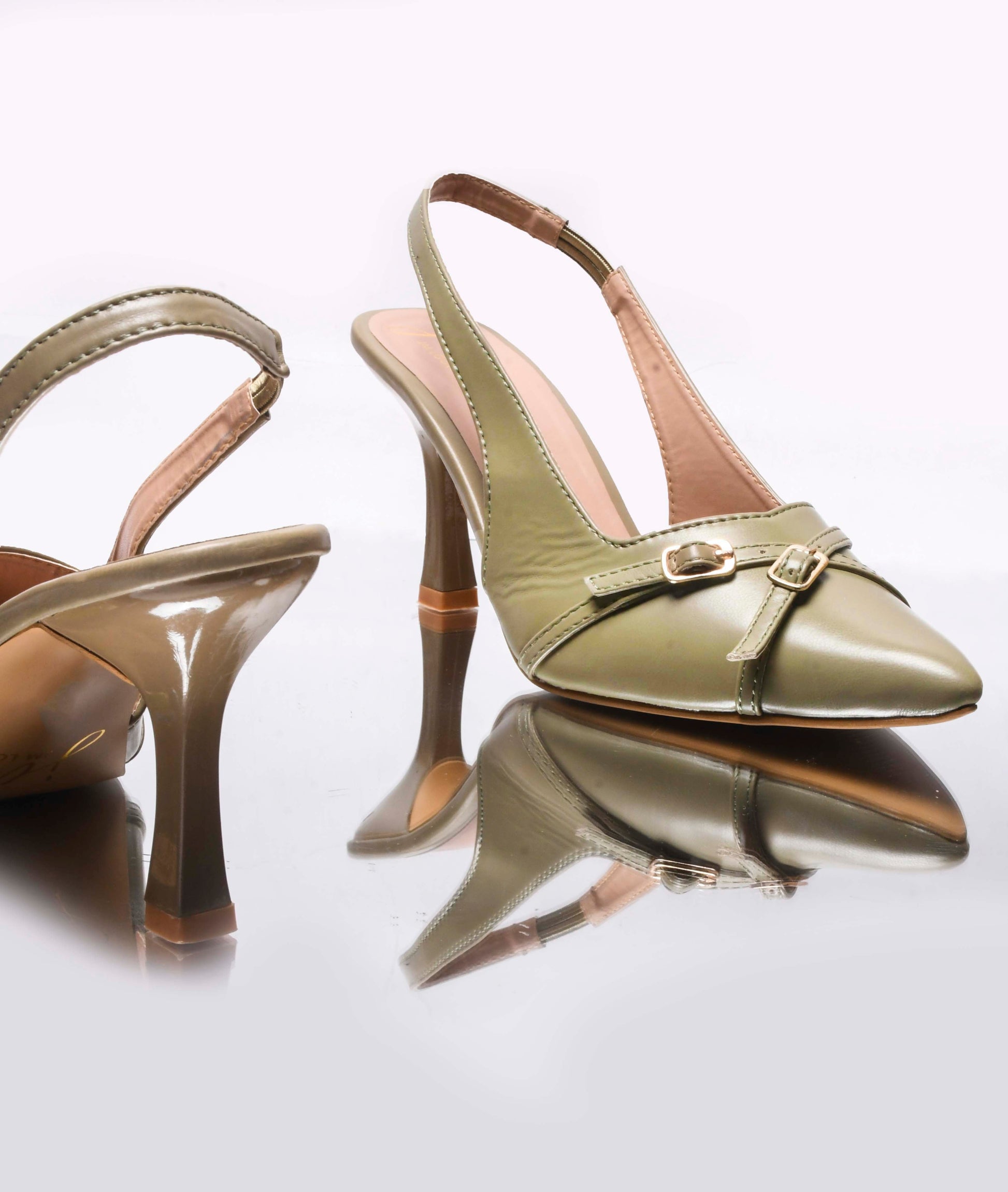 A pointed-toe slingback heel with strap and buckle details on the vamp and an adjustable strap
 Green