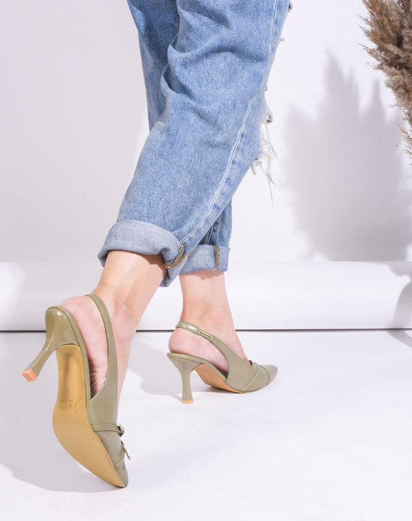 A pointed-toe slingback heel with strap and buckle details on the vamp and an adjustable strap
 Green