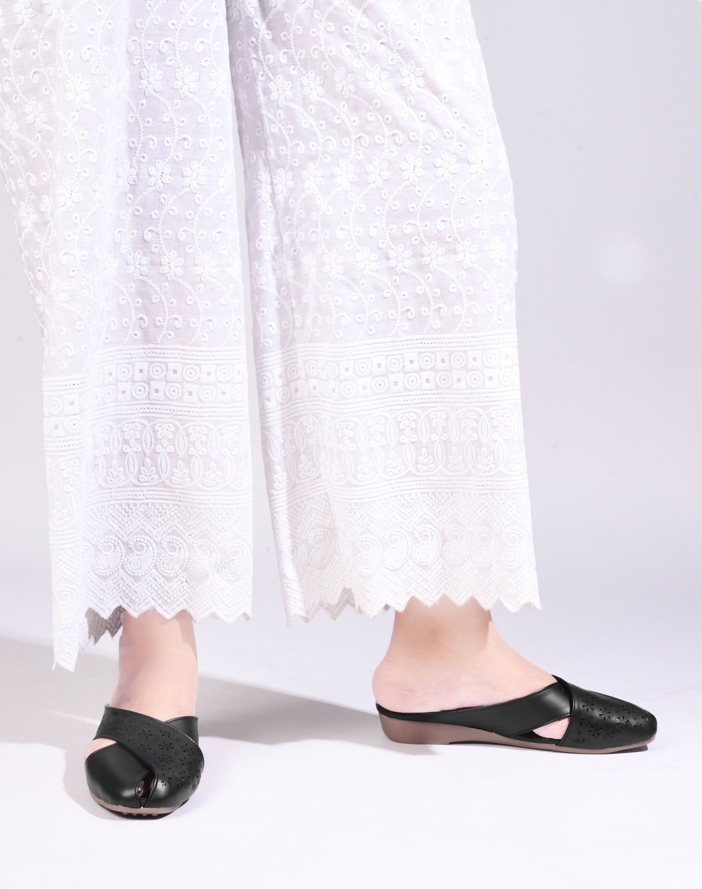 JM Looks women's mules with laser-cut cross straps and a closed toe
 Black