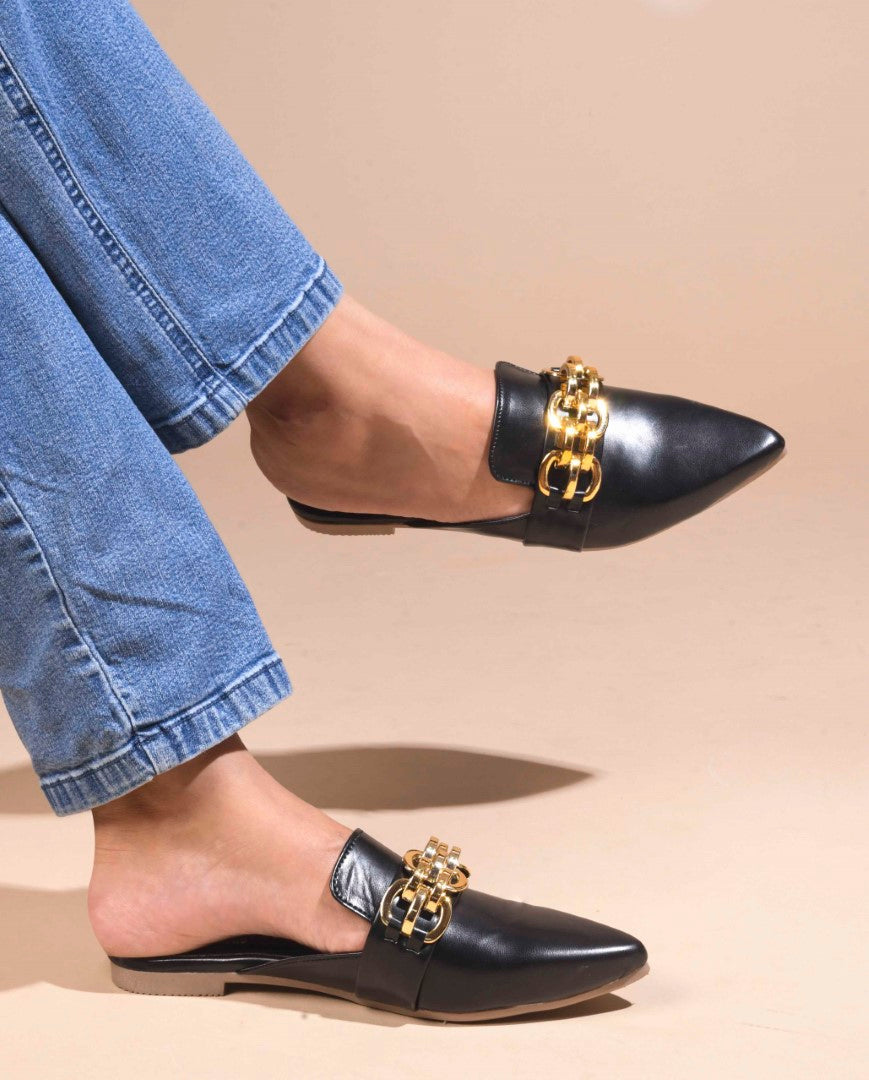JM Looks women's pointed-toe mules featuring a bold metallic chain detail on the strap
 Black