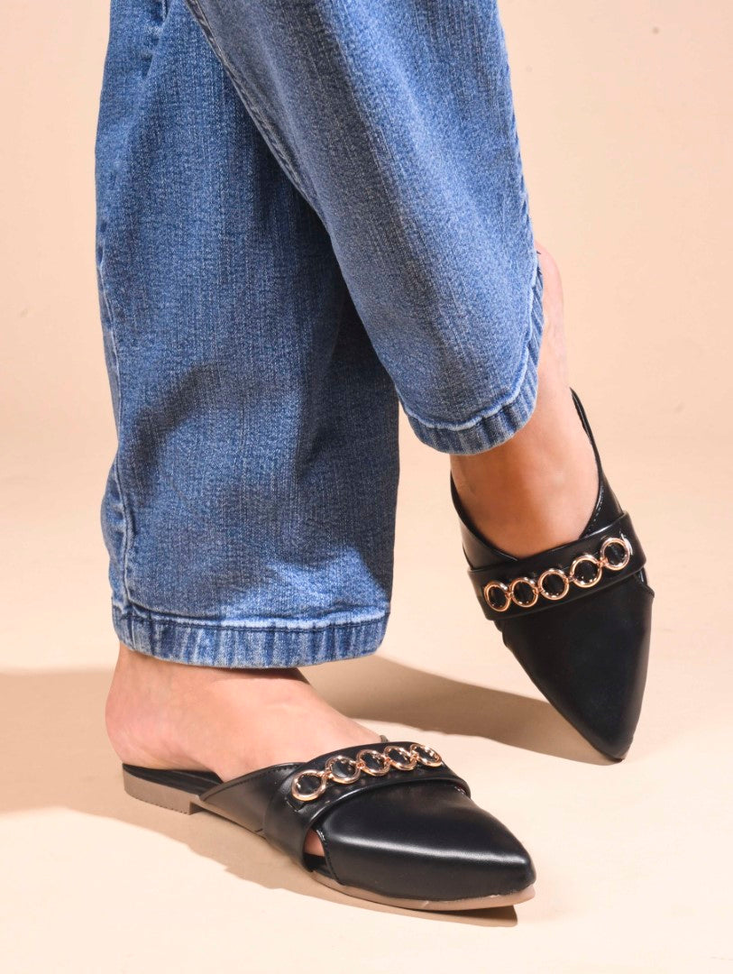 JM Looks women's pointed-toe mules with a strap adorned with circular metallic chain details
 Black