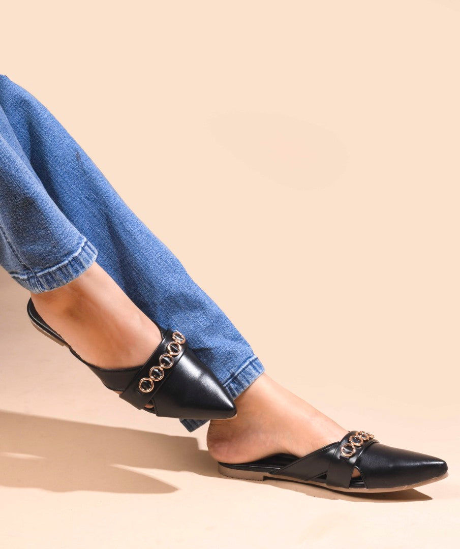 JM Looks women's pointed-toe mules with a strap adorned with circular metallic chain details
 Black