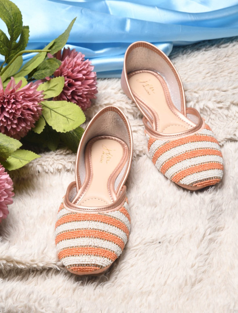 Jm Looks juttis featuring a black and white striped beaded pattern
 Peach