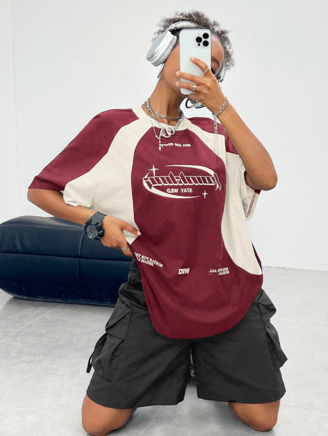 Oversized streetwear graphic t-shirt in maroon with cream side panels and bold typography front back design