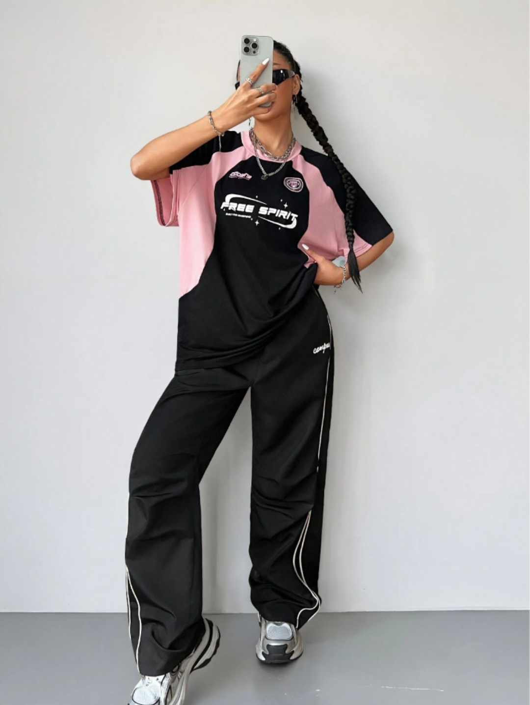 Oversized streetwear graphic t-shirt in black with pink side panels and bold typography front back design