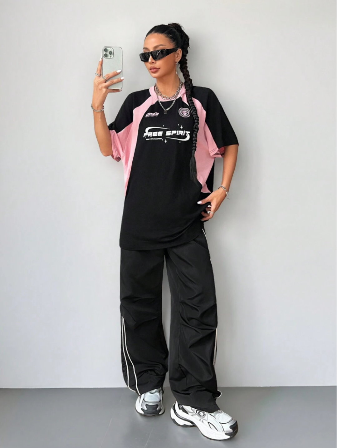 Oversized streetwear graphic t-shirt in black with pink side panels and bold typography front back design