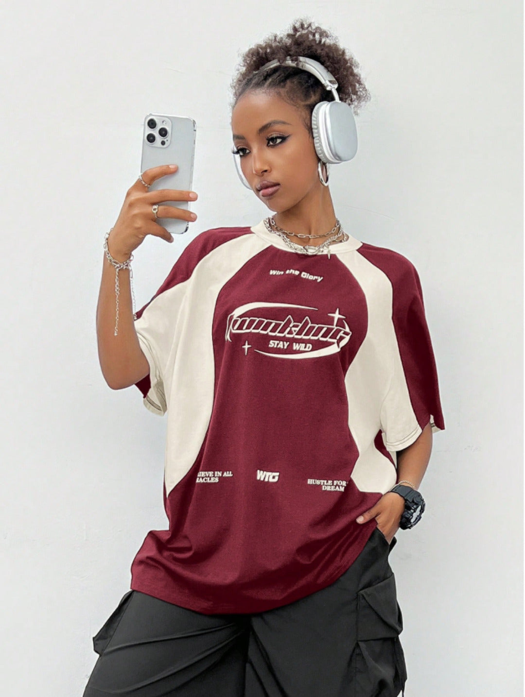 Oversized colorblock t-shirt for women in maroon and cream with graphic text print and drop shoulders