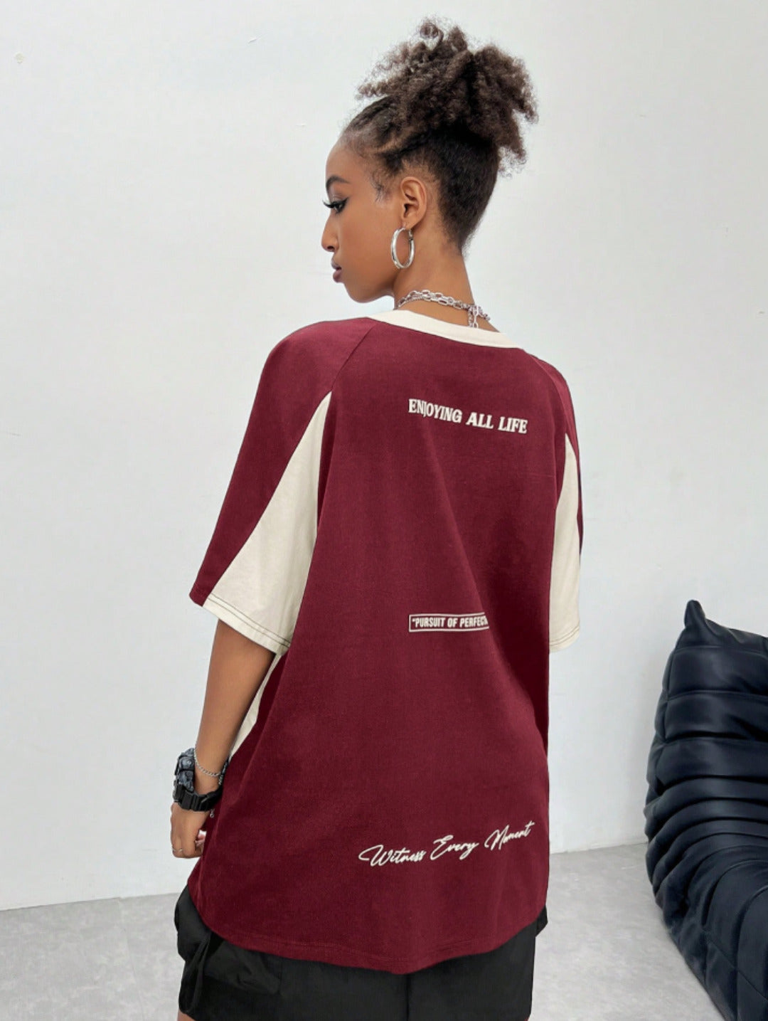 Oversized colorblock t-shirt for women in maroon and cream with graphic text print and drop shoulders