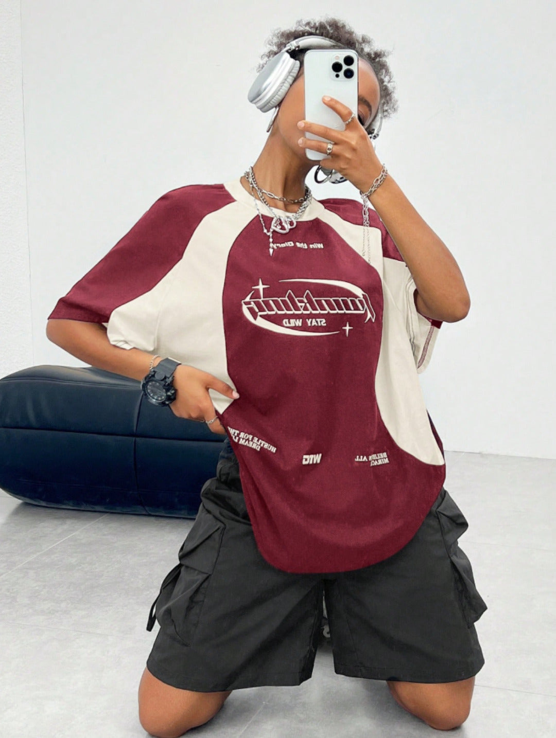 Oversized colorblock t-shirt for women in maroon and cream with graphic text print and drop shoulders