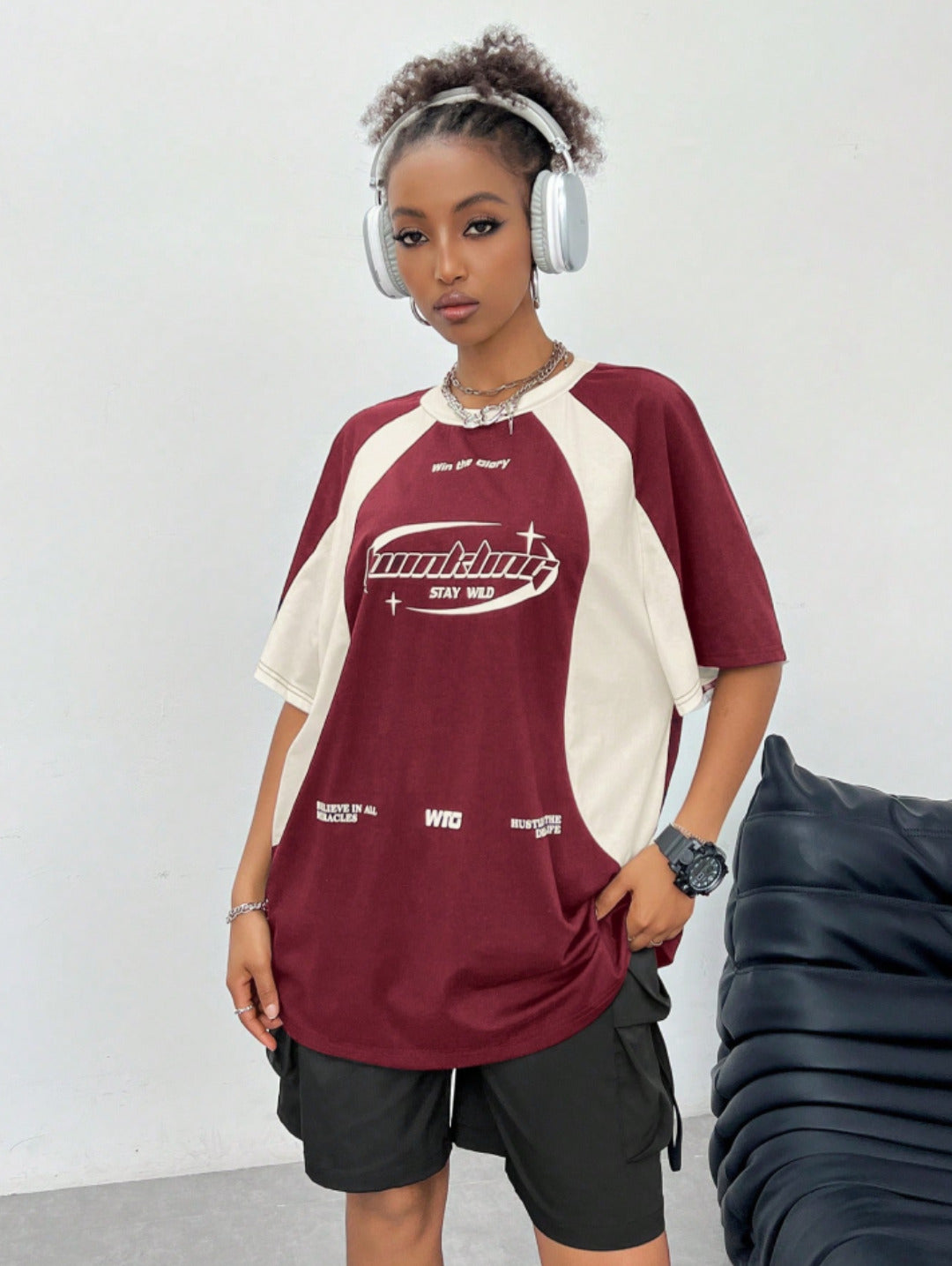 Oversized colorblock t-shirt for women in maroon and cream with graphic text print and drop shoulders