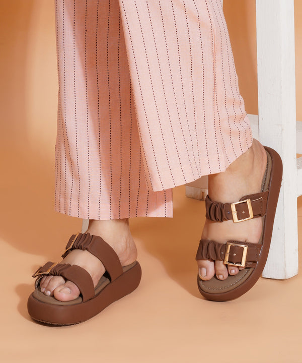 Platform sandals for women in brown with ruched dual straps, gold buckles and thick cushioned footbed