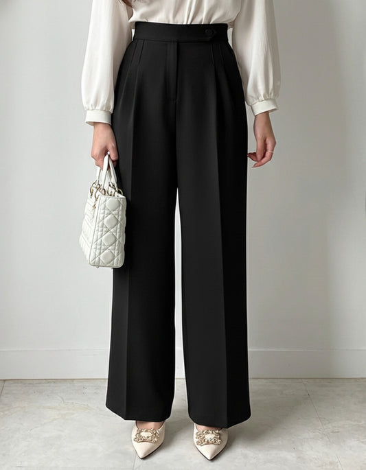 Pleated wide leg flowy trousers in black, high waist button closure, styled with white satin blouse