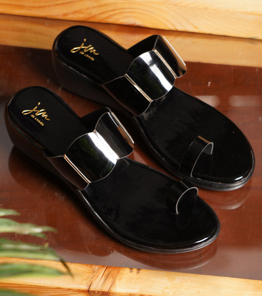 Wedge sandals for women in glossy black patent with gold bar accents and toe-ring strap design