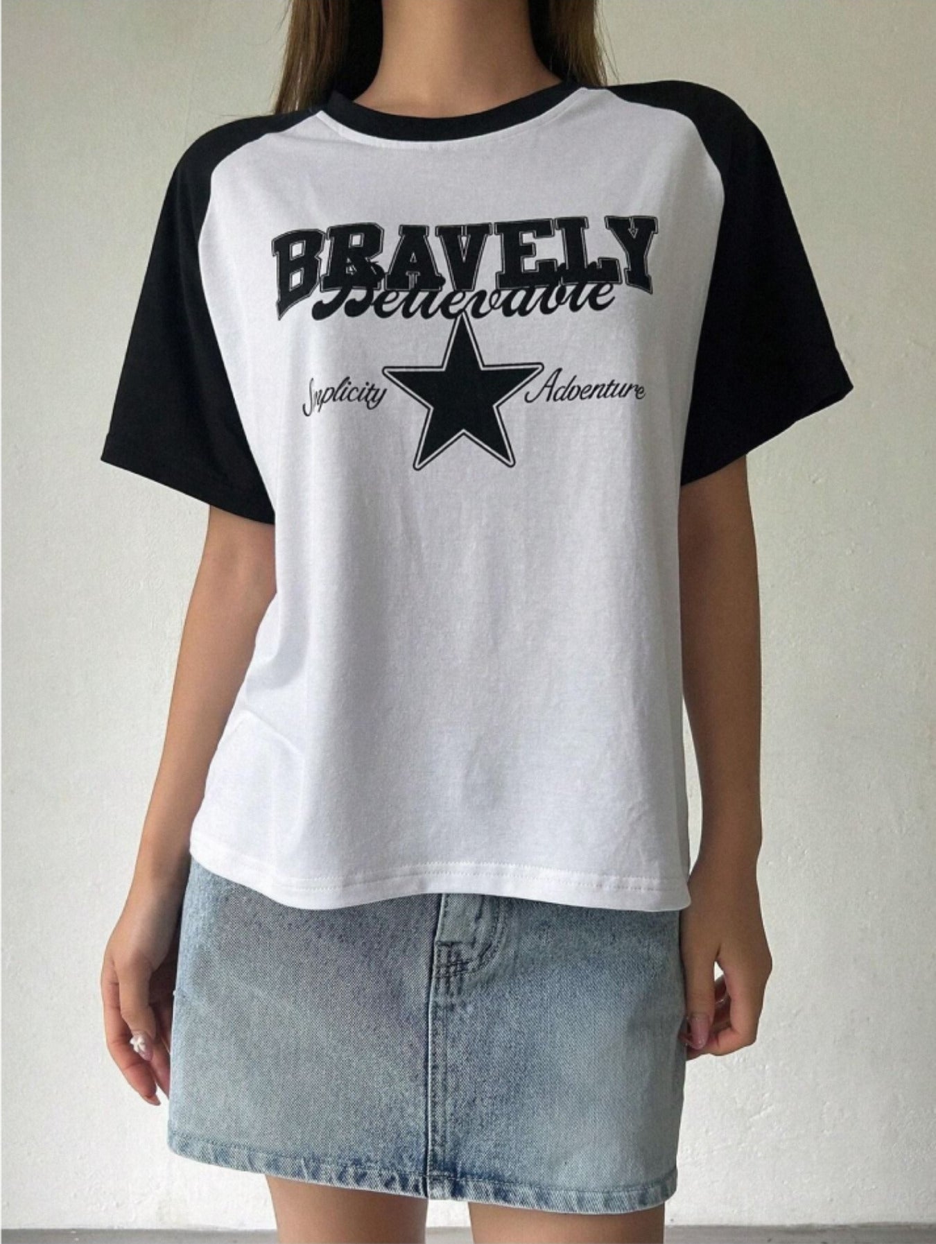 Raglan t-shirt for women in white with black half sleeves, front star print and round neck.