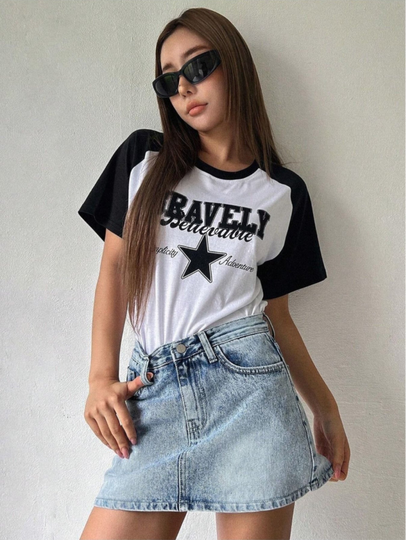 Raglan t-shirt for women in white with black half sleeves, front star print and round neck.
