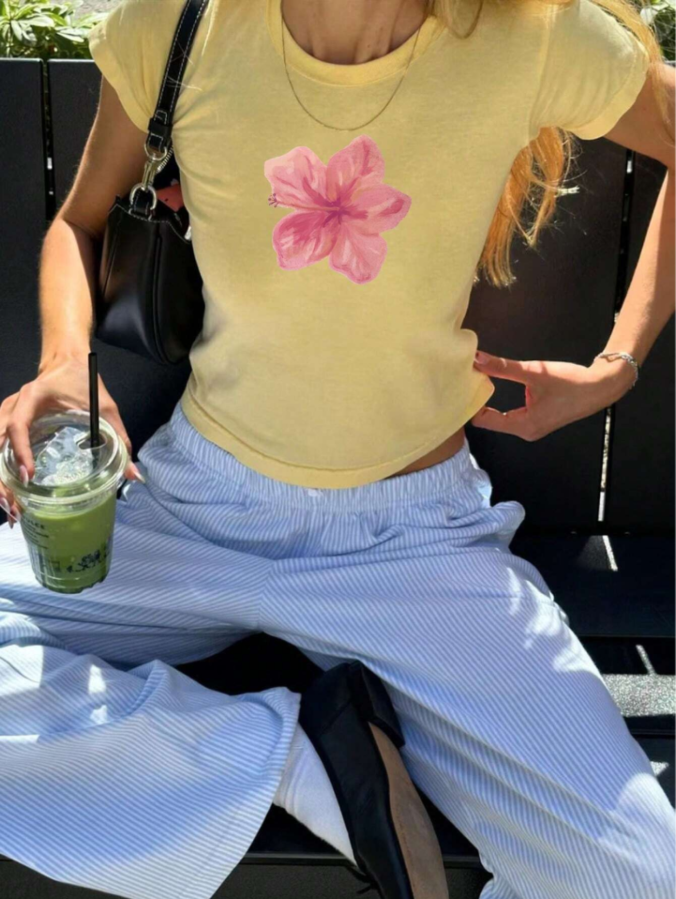 Floral crop t-shirt for women featuring pink hibiscus print, round neck, short sleeves, yellow cotton fabric