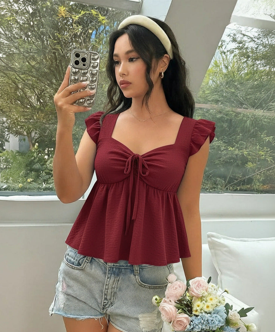 Ruffle trim blouse with sweetheart neckline in red cherry, featuring smocked bodice, flutter sleeves, flared peplum hem