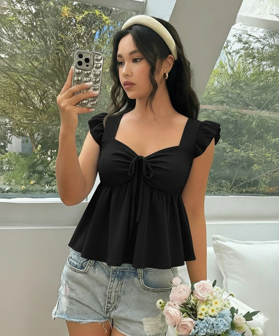 Ruffle trim blouse with sweetheart neckline in black, featuring smocked bodice, flutter sleeves, flared peplum hem