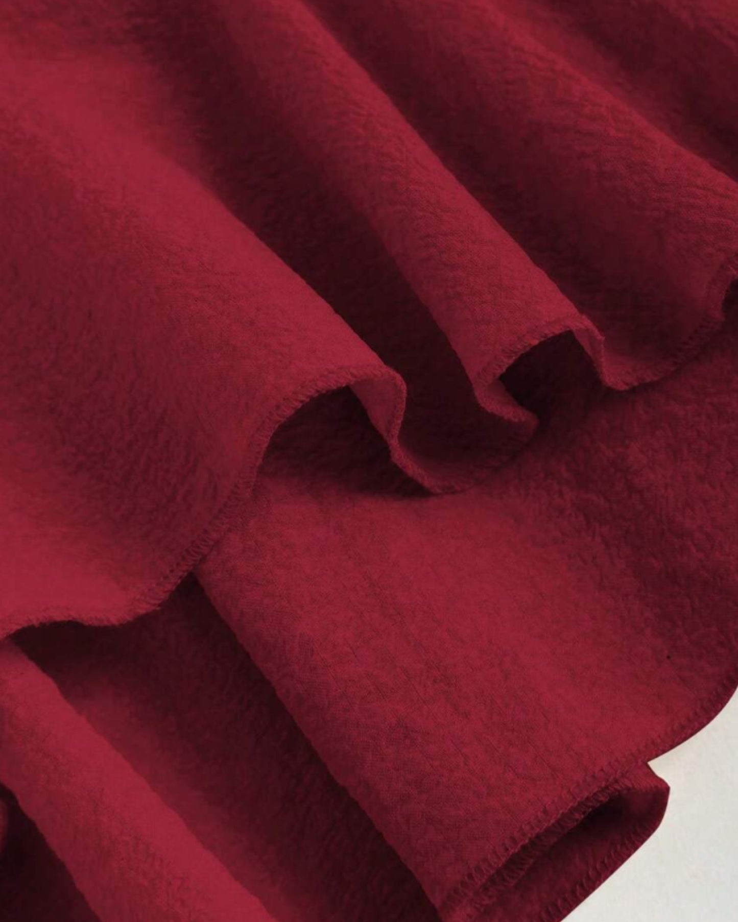 Ruffle trim blouse with sweetheart neckline in red cherry, featuring smocked bodice, flutter sleeves, flared peplum hem