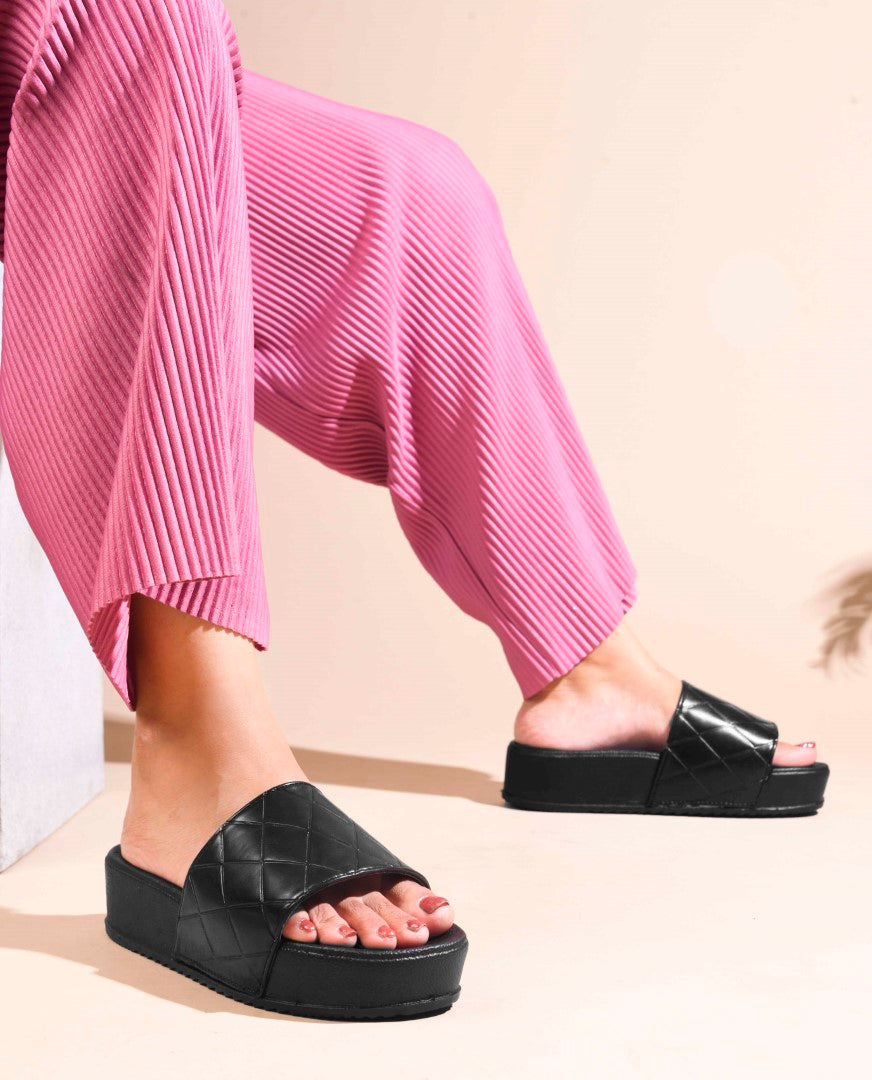 women's platform slides with a quilted upper strap
 Black