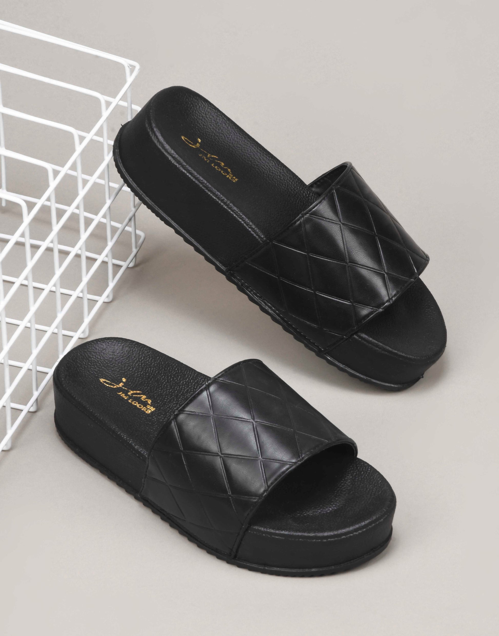 women's platform slides with a quilted upper strap
 Black