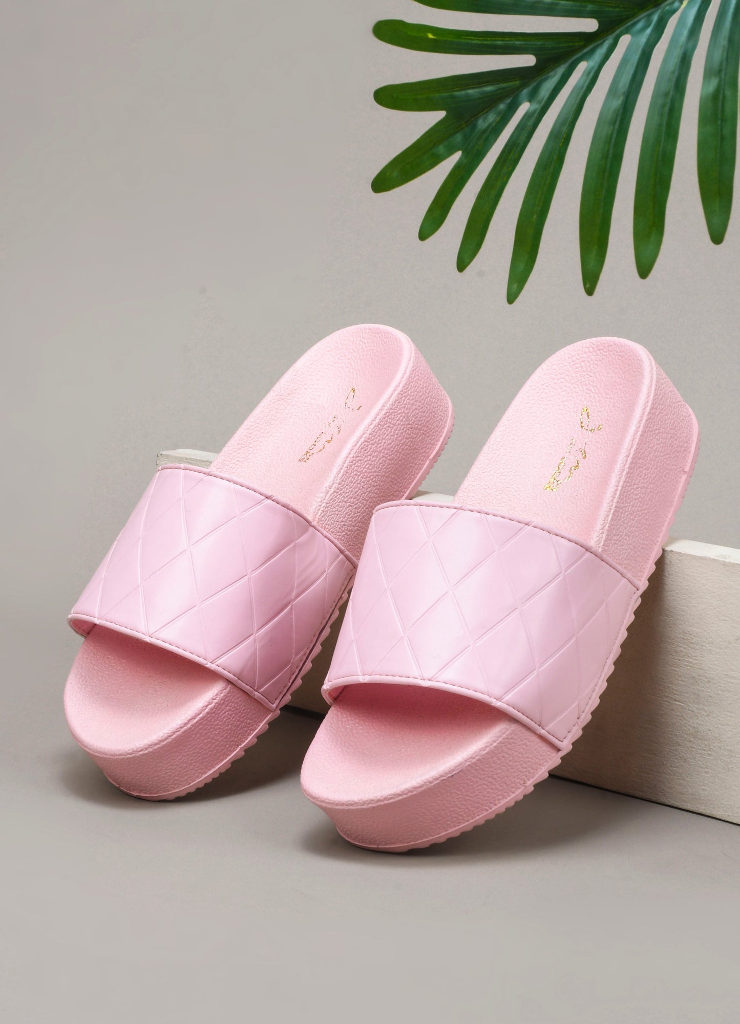 women's platform slides with a quilted upper strap
 Pink