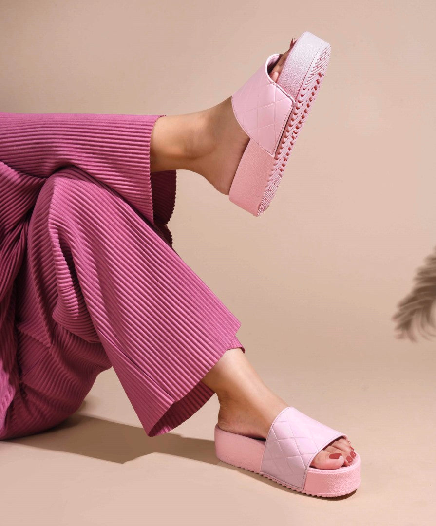 women's platform slides with a quilted upper strap
 Pink