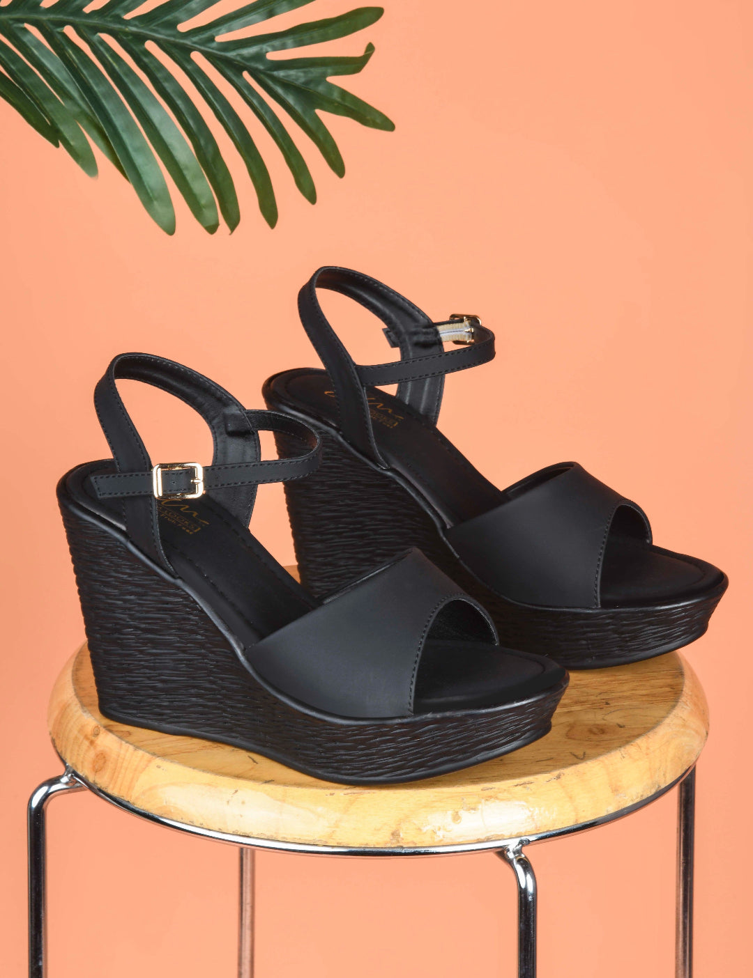 Black peep-toe wedge heels with ankle buckle strap