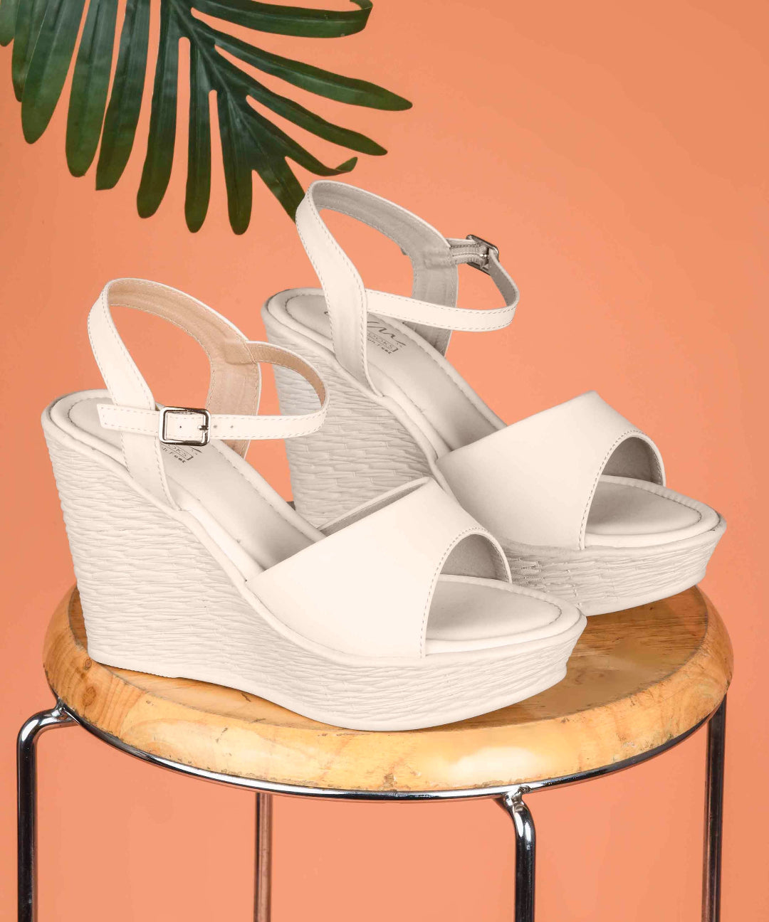 Cream peep-toe wedge heels with ankle buckle strap
