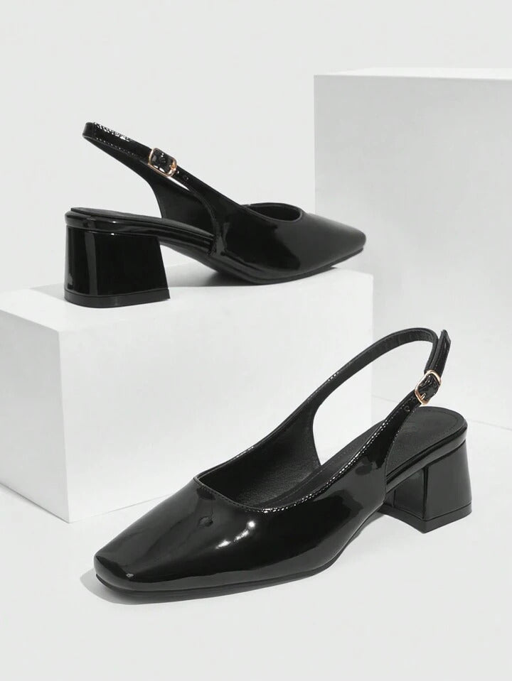 Slingback block heel pumps in black patent finish with square toe and adjustable ankle buckle strap