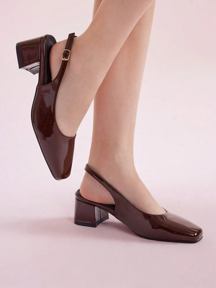 Slingback block heel pumps in cherry red patent finish with square toe and adjustable ankle buckle strap