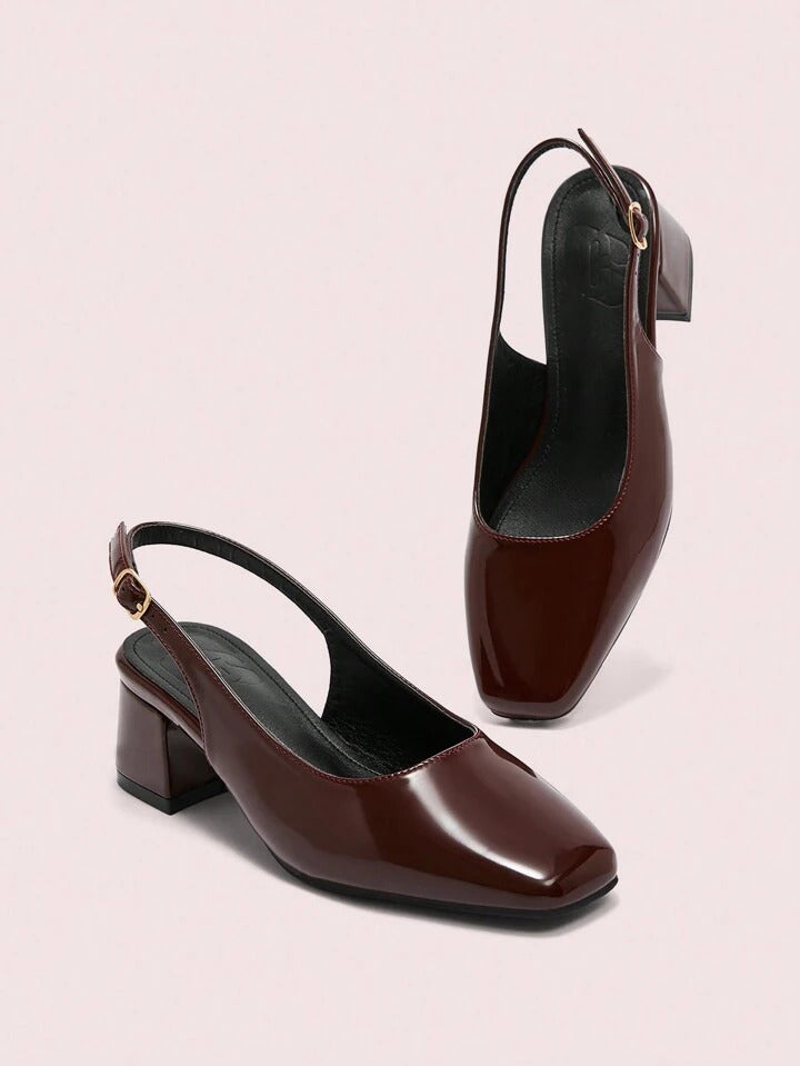 Slingback block heel pumps in cherry red patent finish with square toe and adjustable ankle buckle strap