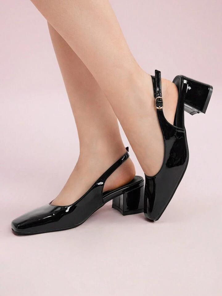 Slingback block heel pumps in black patent finish with square toe and adjustable ankle buckle strap