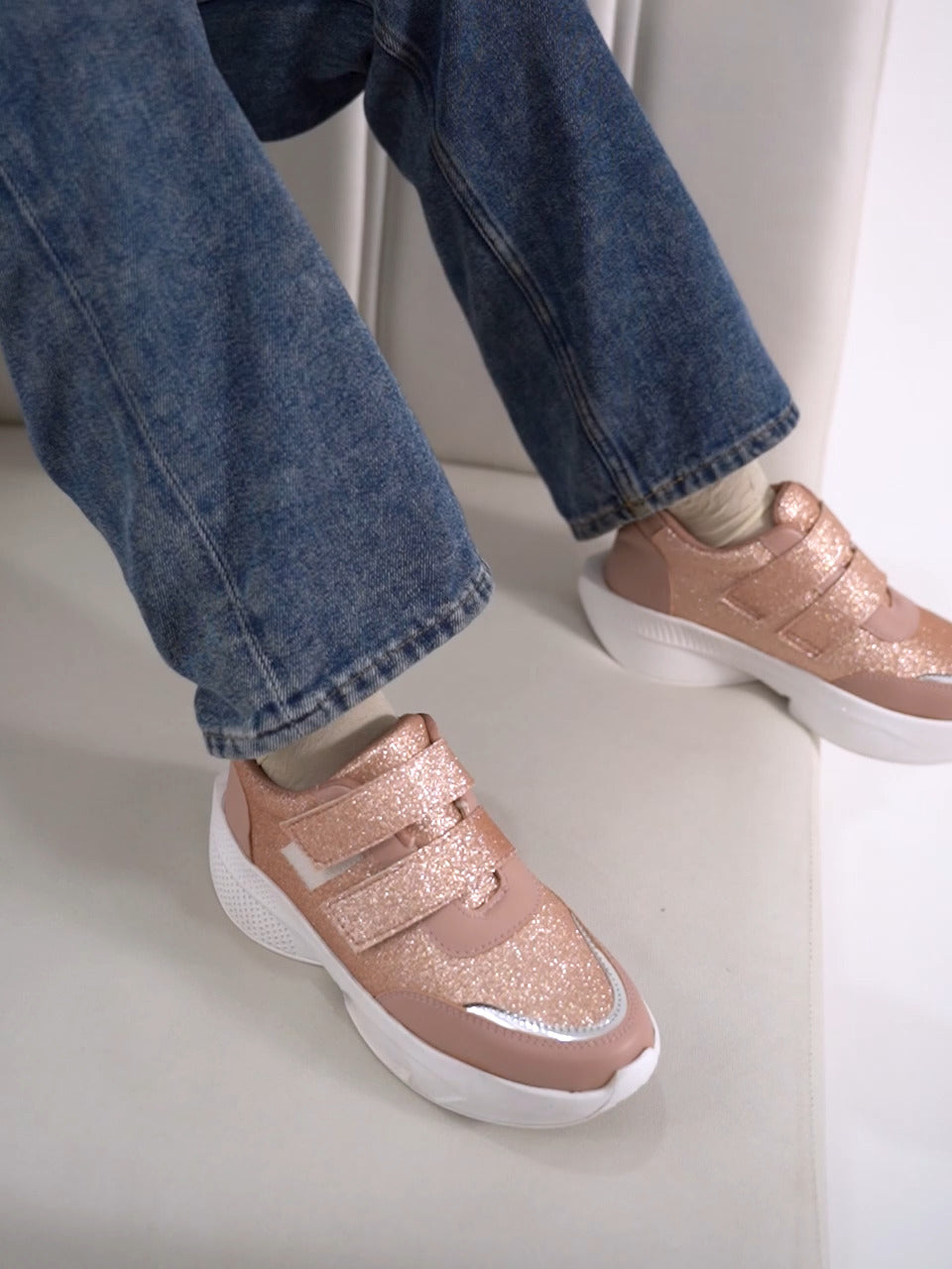 Glitter sneakers for women in Peach with dual velcro straps, white platform sole, silver toe.