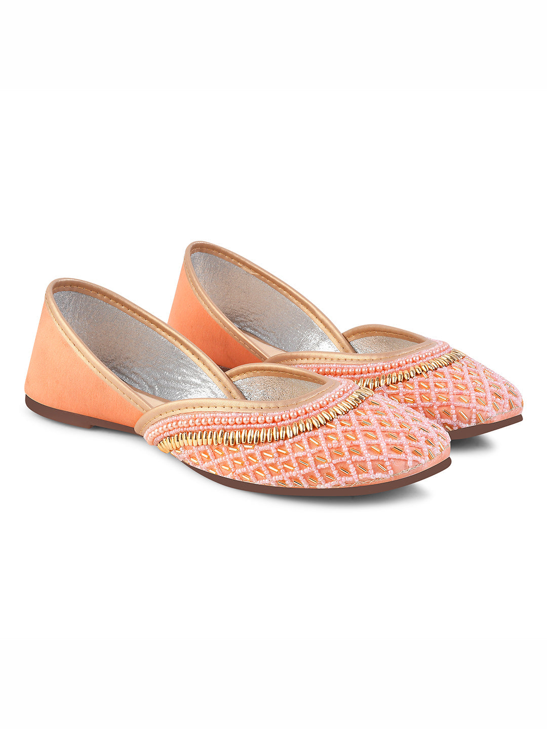 traditional juttis with intricate beaded work in a geometric pattern on the upper
 Peach