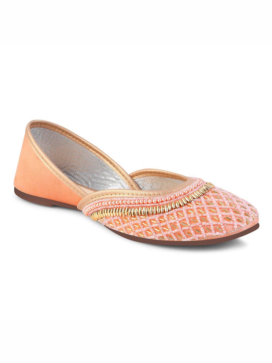 traditional juttis with intricate beaded work in a geometric pattern on the upper
 Peach