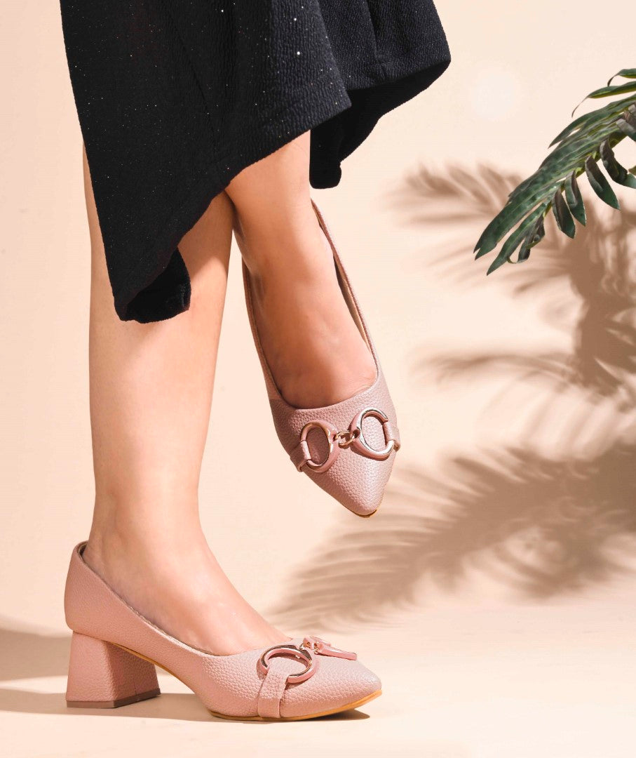 women's block heel pumps featuring a pointed toe and a decorative buckle embellishment
 Peach